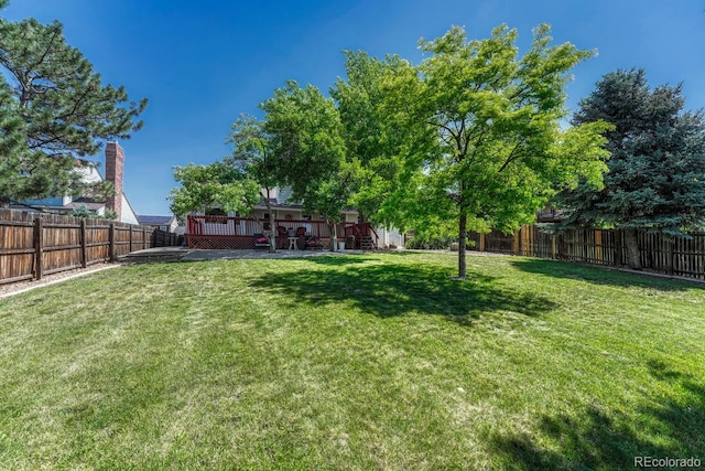 1572 W Long Ave, Littleton, CO 80120 - fenced backyard with a wooden deck