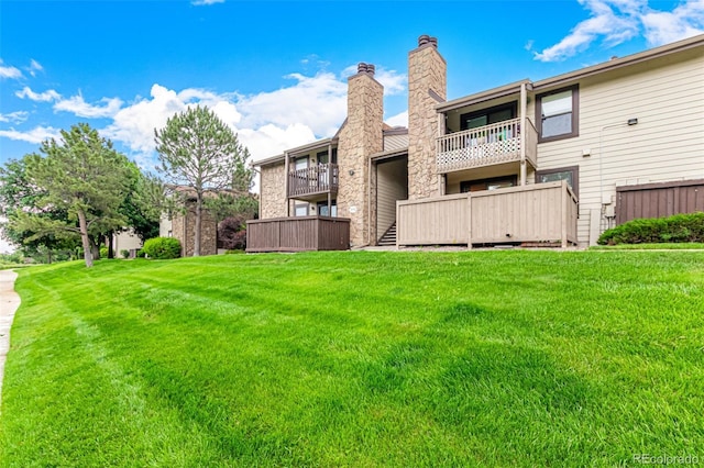 7750 W 87th Dr Unit C, Arvada, CO 80005 - rear view of house with a lawn