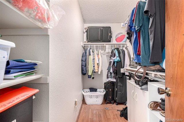 7750 W 87th Dr Unit C, Arvada, CO 80005 - walk in closet featuring wood finished floors