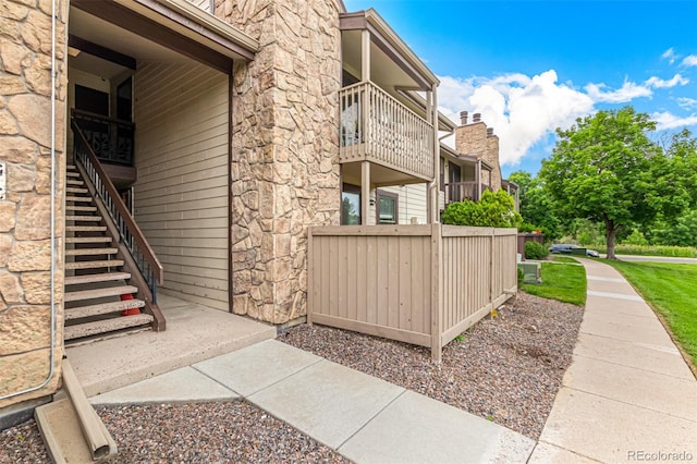7750 W 87th Dr Unit C, Arvada, CO 80005 - view of side of property with stairway and stone siding
