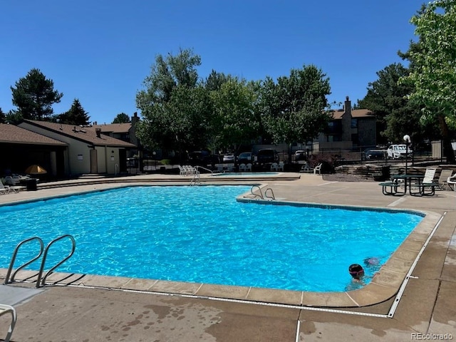 7750 W 87th Dr Unit C, Arvada, CO 80005 - community pool featuring a patio