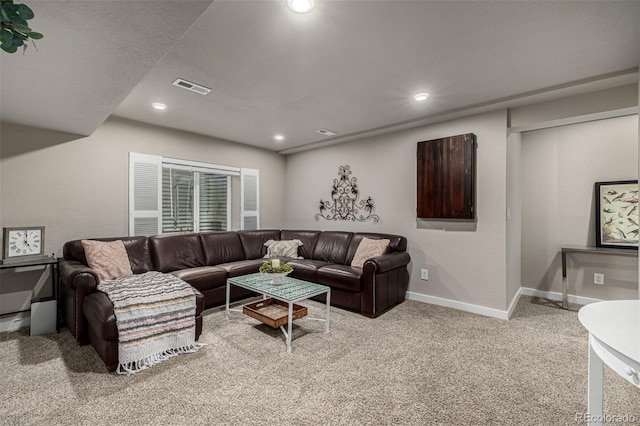 living area featuring visible vents, recessed lighting, baseboards, and carpet floors