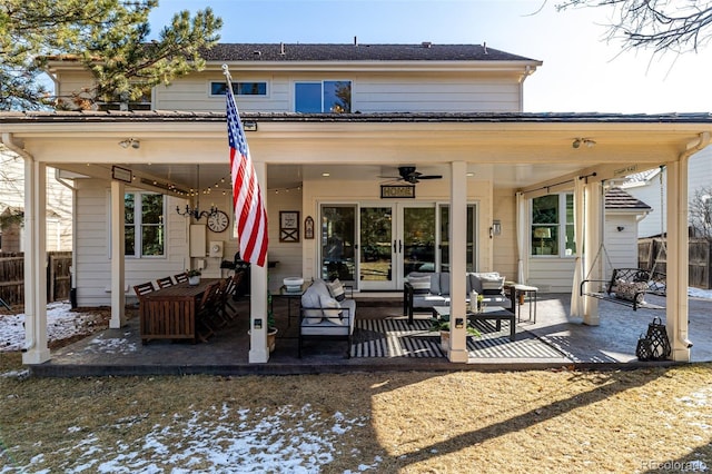 back of house with an outdoor living space, a patio area, and fence