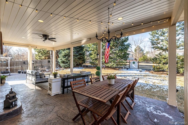 view of patio / terrace featuring outdoor lounge area, fence, and a ceiling fan