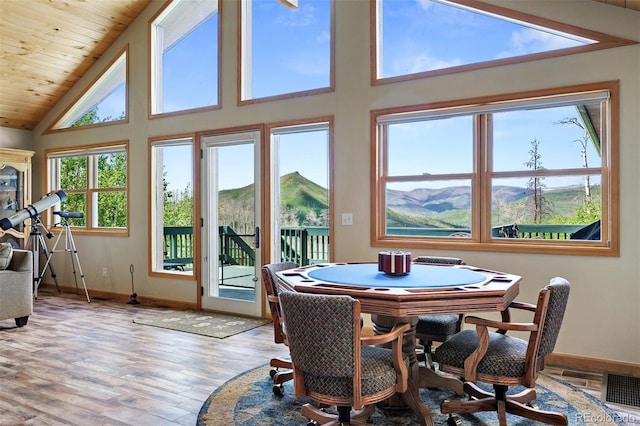 116 County Road 414, Granby, CO 80446 - dining space with wood finished floors, high vaulted ceiling, a mountain view, and wood ceiling