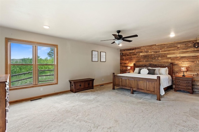 116 County Road 414, Granby, CO 80446 - carpeted bedroom with wooden walls, a ceiling fan, and recessed lighting