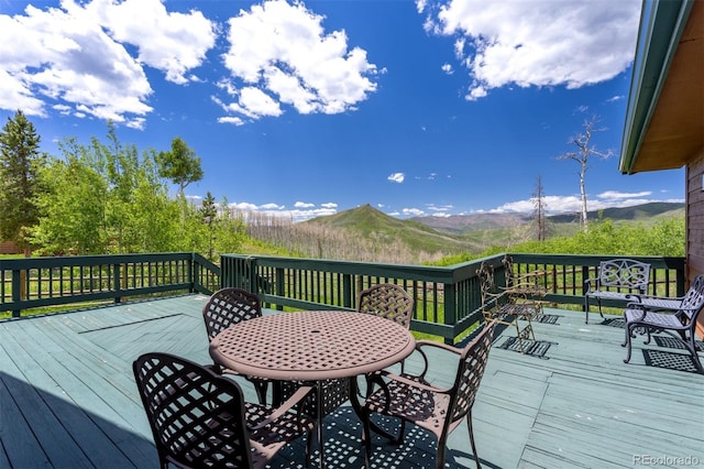116 County Road 414, Granby, CO 80446 - wooden terrace featuring a mountain view and outdoor dining area