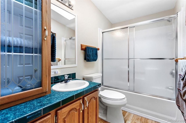 116 County Road 414, Granby, CO 80446 - bathroom featuring vanity, shower / bath combination with glass door, and wood finished floors