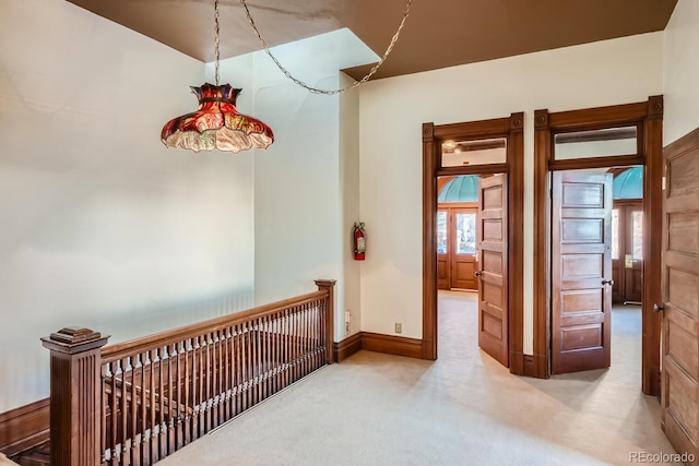 hallway featuring carpet flooring