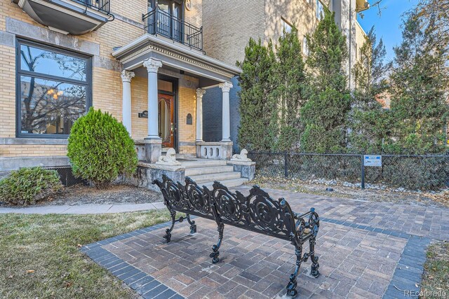 property entrance with a balcony