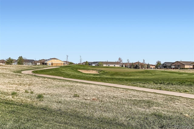 surrounding community featuring a residential view and a yard
