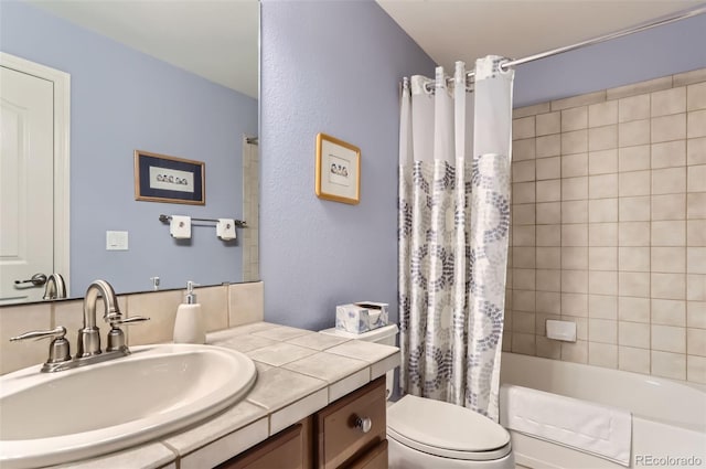bathroom featuring vanity, shower / tub combo, and toilet