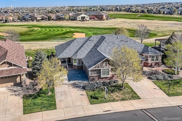 drone / aerial view with a residential view and golf course view