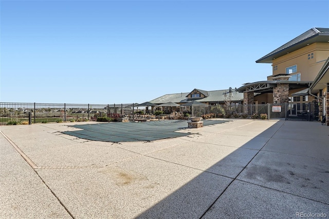 pool featuring a patio and fence