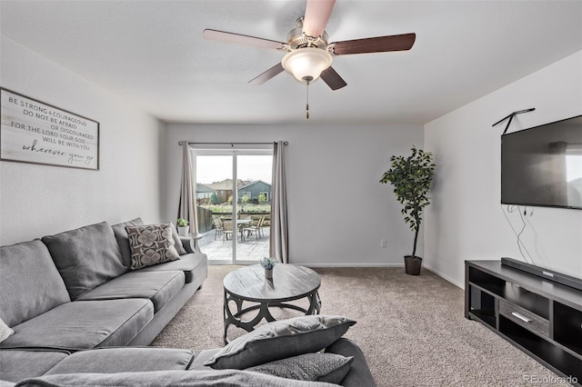 living area with carpet floors, a ceiling fan, and baseboards