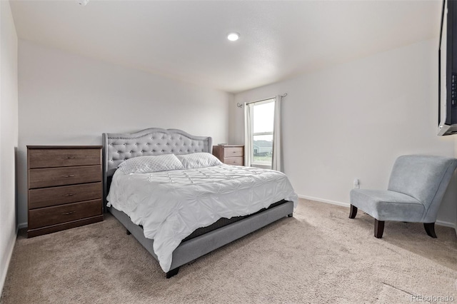 carpeted bedroom featuring baseboards