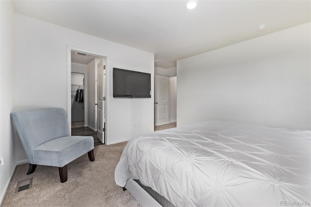 bedroom with baseboards, carpet, recessed lighting, and a spacious closet