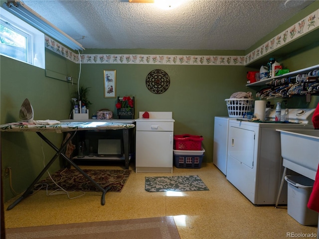 8908 Jellison Ct, Westminster, CO 80021 - laundry room with independent washer and dryer, a textured ceiling, and light flooring