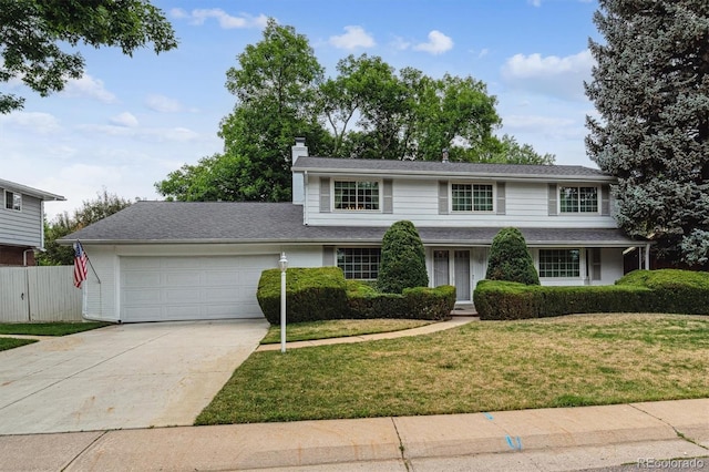 7129 S Marshall St, Littleton, CO 80128 - traditional-style home with a garage, a chimney, and concrete driveway
