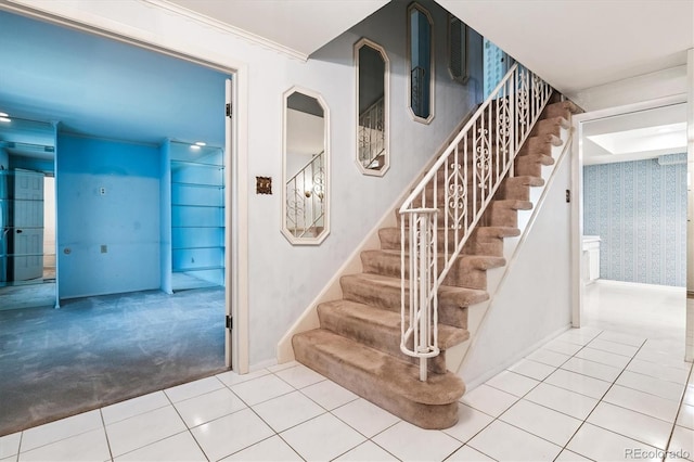 7129 S Marshall St, Littleton, CO 80128 - stairway featuring tile patterned floors, carpet floors, and wallpapered walls