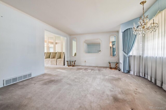 7129 S Marshall St, Littleton, CO 80128 - unfurnished living room featuring a chandelier, carpet flooring, and crown molding