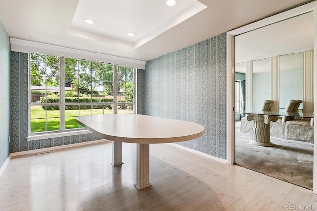 7129 S Marshall St, Littleton, CO 80128 - dining space with wallpapered walls, healthy amount of natural light, wood finished floors, a raised ceiling, and recessed lighting