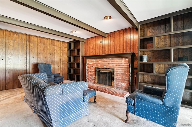 7129 S Marshall St, Littleton, CO 80128 - carpeted living area featuring wood walls, beam ceiling, and a fireplace