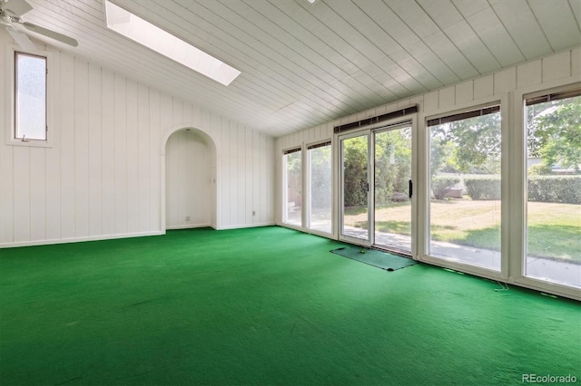 7129 S Marshall St, Littleton, CO 80128 - unfurnished sunroom with vaulted ceiling, healthy amount of natural light, a skylight, and arched walkways
