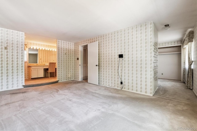 7129 S Marshall St, Littleton, CO 80128 - unfurnished living room featuring wallpapered walls and carpet