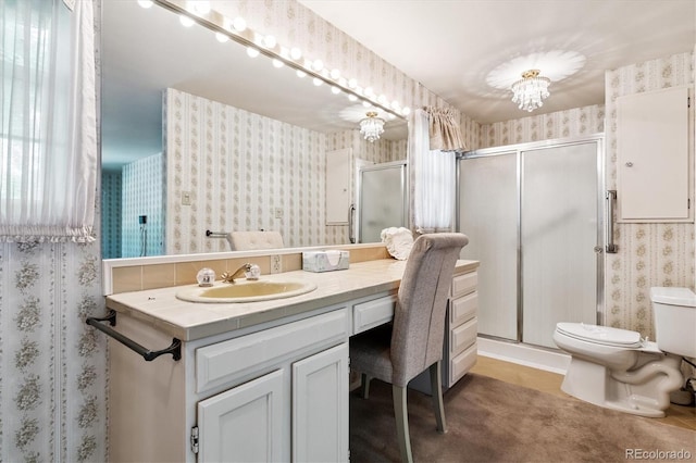 7129 S Marshall St, Littleton, CO 80128 - full bath with wallpapered walls, vanity, and a stall shower