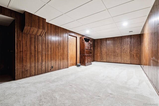 7129 S Marshall St, Littleton, CO 80128 - finished basement with light colored carpet and wooden walls