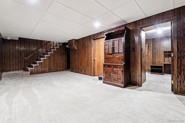 7129 S Marshall St, Littleton, CO 80128 - finished basement featuring wood walls, stairway, and carpet