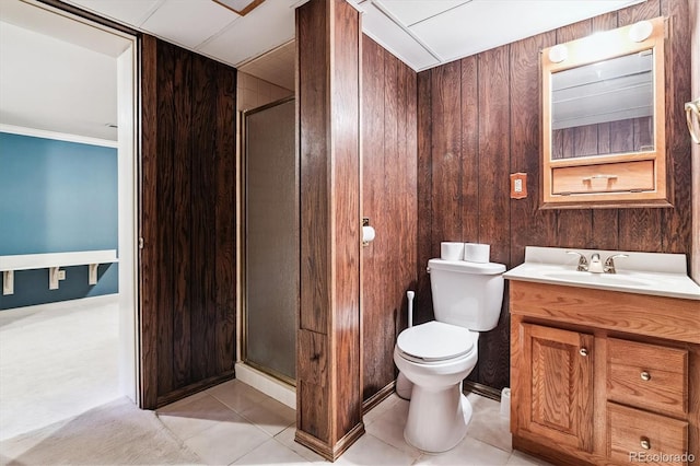 7129 S Marshall St, Littleton, CO 80128 - full bath featuring vanity, a stall shower, wooden walls, tile patterned flooring, and crown molding