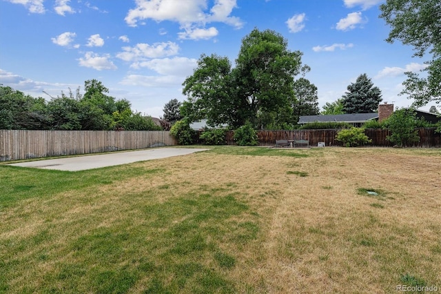 7129 S Marshall St, Littleton, CO 80128 - fenced backyard featuring a patio area