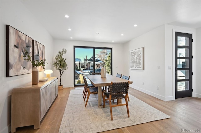 dining room with light hardwood / wood-style floors