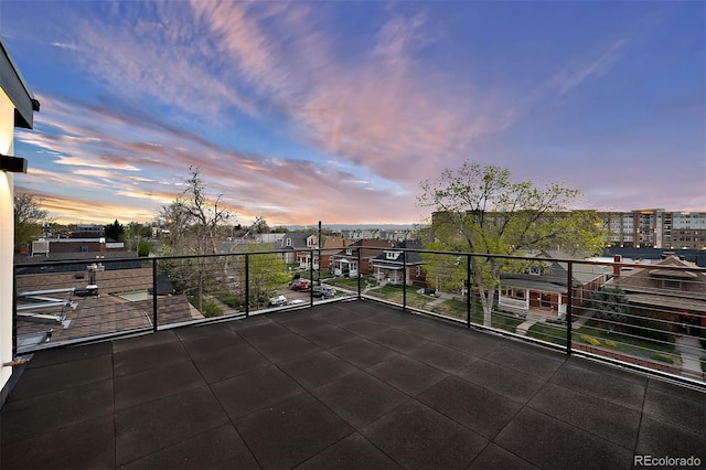 patio terrace at dusk with a balcony