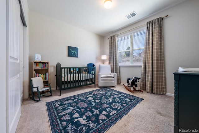 bedroom with carpet flooring and visible vents