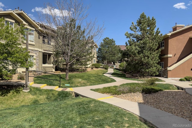 view of community with a lawn