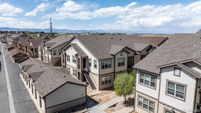 exterior space with a mountain view and a residential view