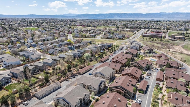 birds eye view of property with a residential view and a mountain view