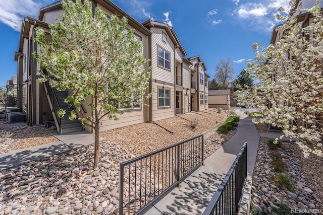view of home's exterior featuring fence