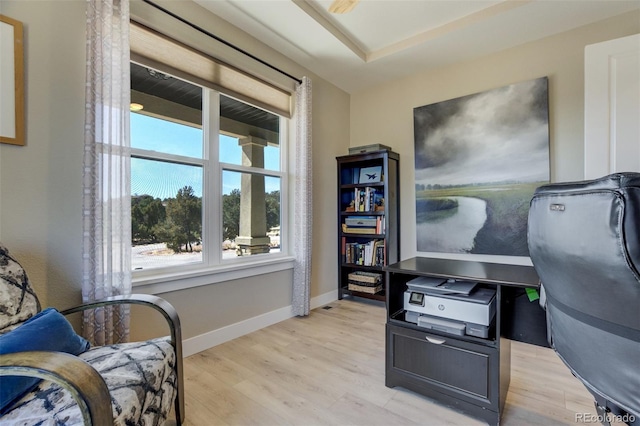 office featuring baseboards and light wood-type flooring