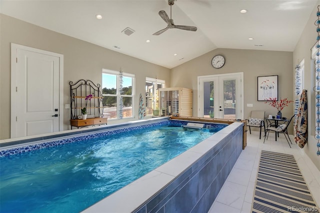 pool with french doors and ceiling fan