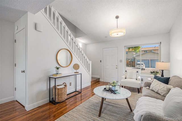 5210 Garrison St Unit 2, Arvada, CO 80002 - living area with stairs, wood finished floors, and a textured ceiling