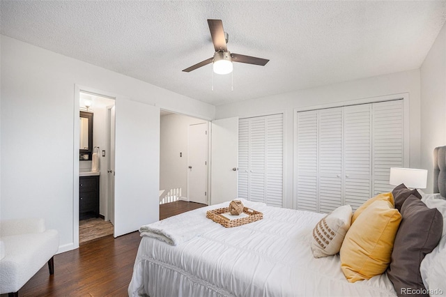 5210 Garrison St Unit 2, Arvada, CO 80002 - bedroom featuring dark wood-style flooring, a textured ceiling, a ceiling fan, and connected bathroom