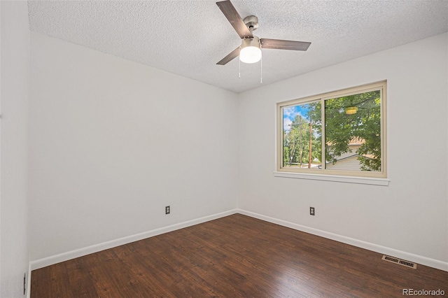 5210 Garrison St Unit 2, Arvada, CO 80002 - spare room featuring dark wood-style floors, a textured ceiling, and a ceiling fan