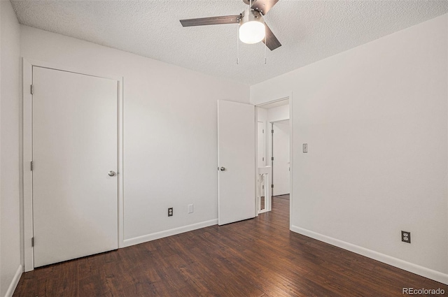 5210 Garrison St Unit 2, Arvada, CO 80002 - unfurnished bedroom with wood finished floors, a textured ceiling, and ceiling fan