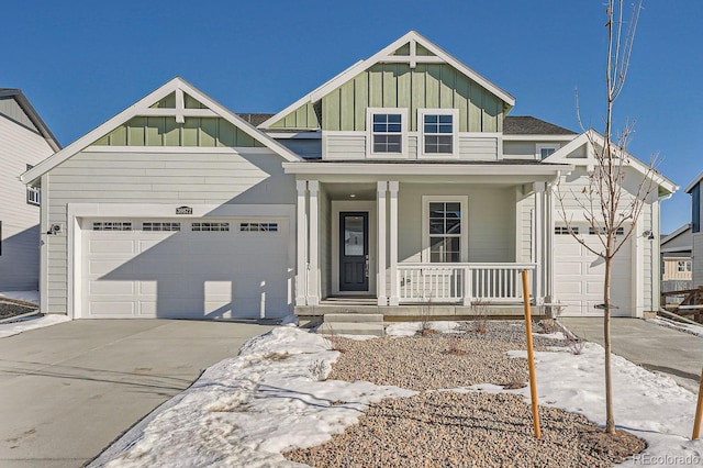 view of front of property with a garage and covered porch