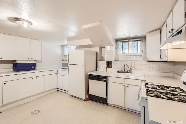 kitchen with white appliances, sink, backsplash, a textured ceiling, and white cabinets