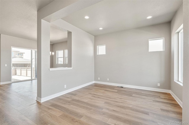 21022 E 63rd Dr, Aurora, CO 80019 - unfurnished room with light hardwood / wood-style floors and a textured ceiling